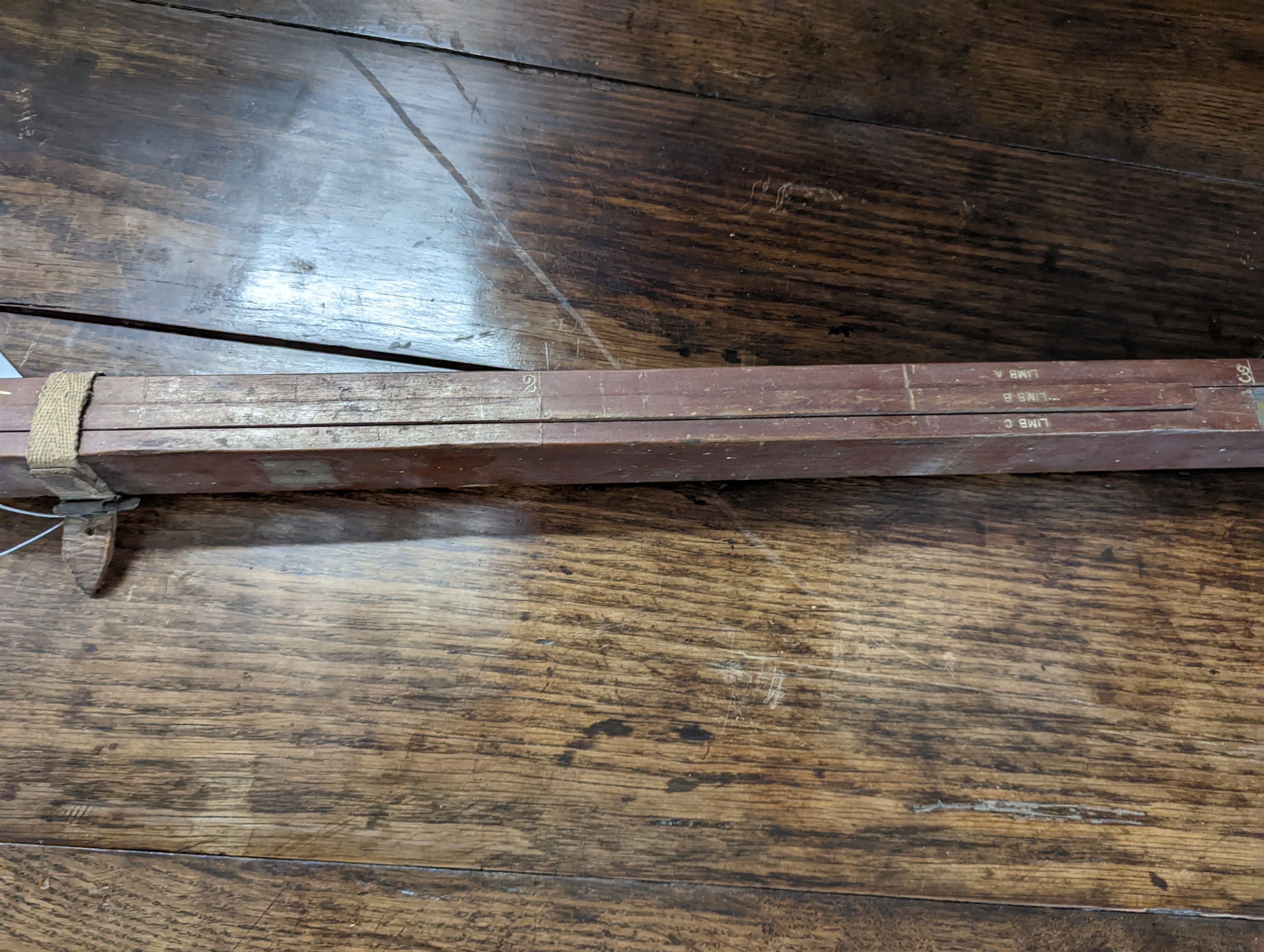 A Houghton & Butcher brass mounted mahogany surveyor's tool, circa 1910, length 126cm